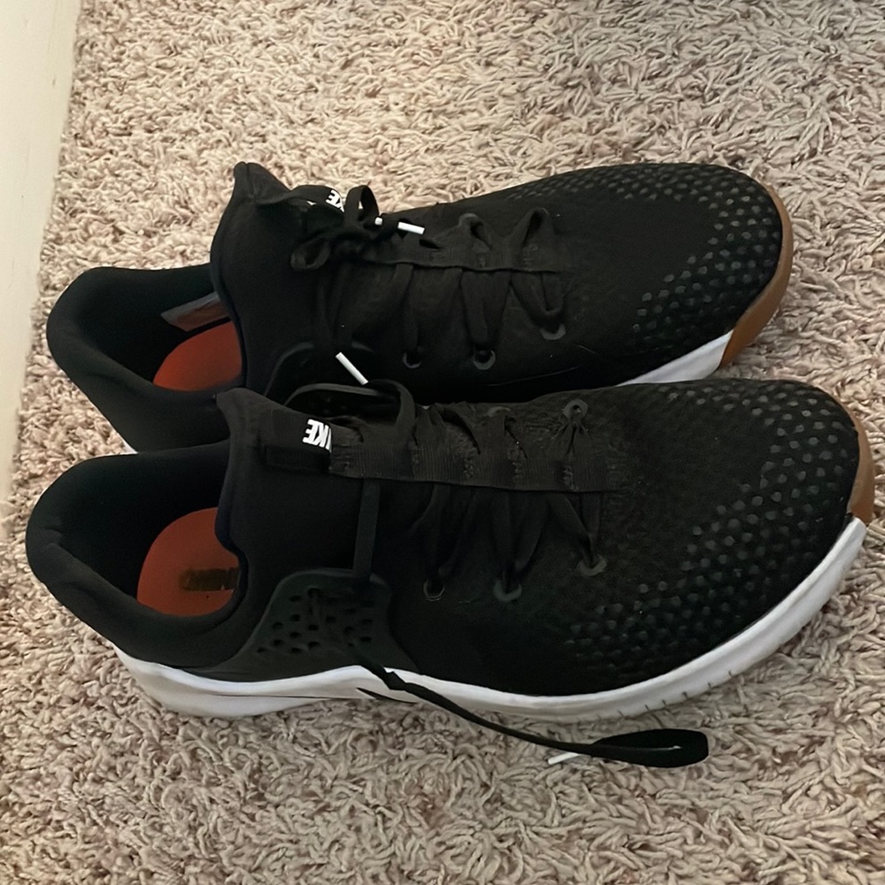 Black Nike training shoes